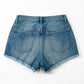 Blue denim shorts on a white background