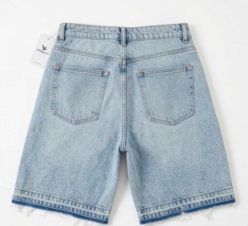 Light blue denim shorts on a white background