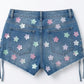 Blue denim shorts with floral patterns on a white background