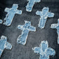 Denim cross patches on a denim fabric background