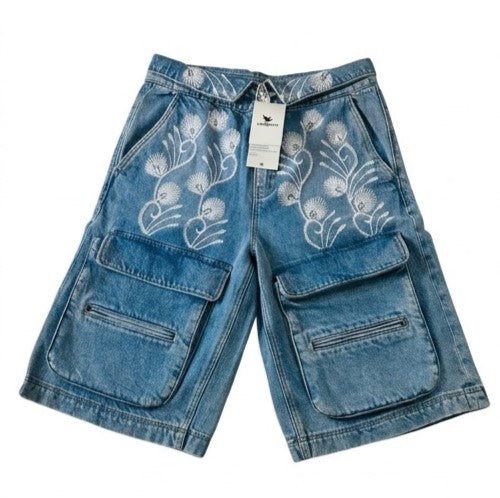 Blue denim shorts with floral embroidery on a white background