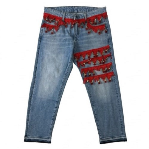 Blue jeans with red embellishments on a white background