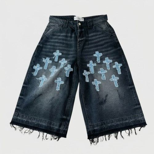 Black denim shorts with blue cross patterns on a white background
