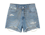 Denim shorts with chain details on a white background
