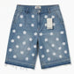 Denim shorts with white floral patterns on a white background