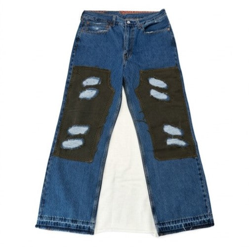 Blue jeans with patches on a white background