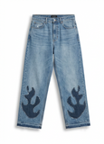 Front view of Wildgeese wave-form appliqué jeans in raw edge indigo patchwork denim, premium handcrafted sustainable fashion.
