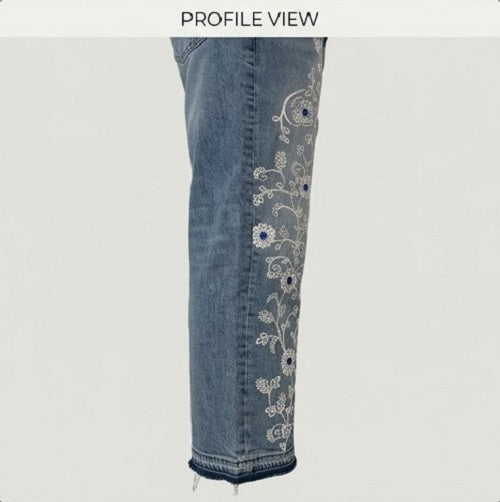 Denim pants with floral embroidery on a white background