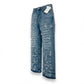 Blue distressed jeans with a tag on a white background