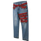 Blue jeans with red fringe and beads on a white background