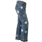 Blue jeans with floral patches on a white background