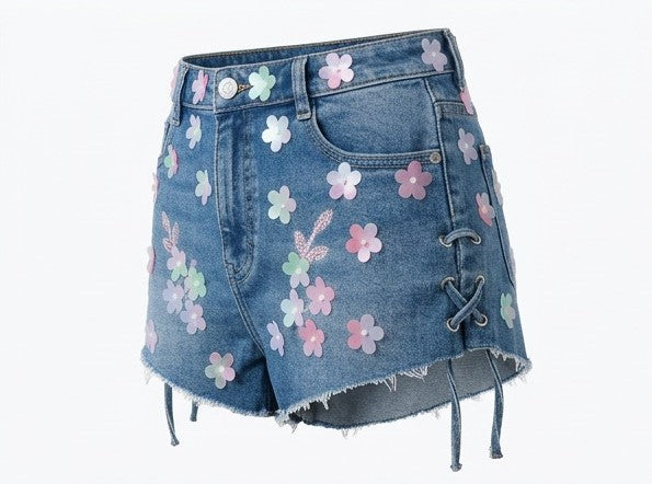 Denim skirt with floral patches on a white background