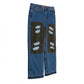 Blue jeans with patches on a white background