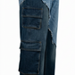 Close-up of blue jeans with multiple pockets on a white background