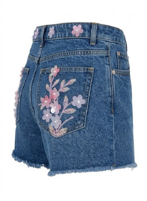 Blue denim skirt with floral embroidery on a white background